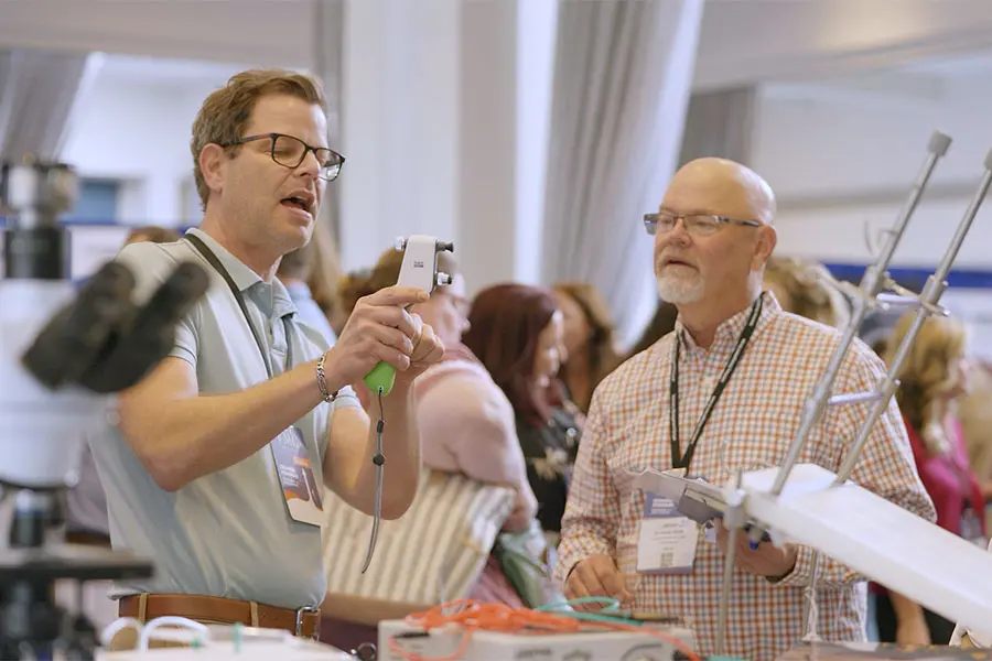 Vendor demonstrating product to veterinarian