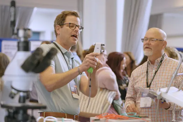 vendor demonstrating product to veterinarian